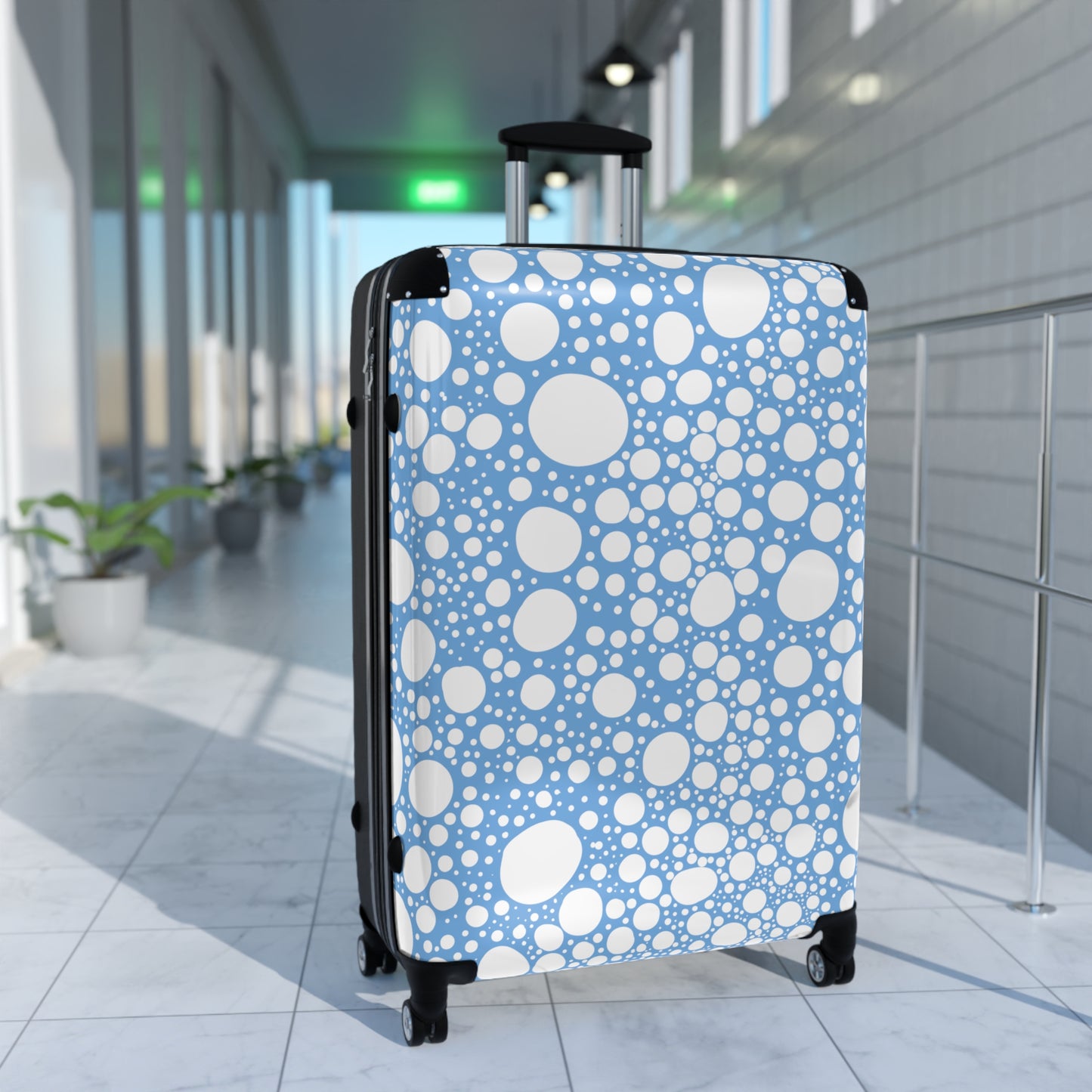 Blanca Ink Spots on Light Blue Suitcase