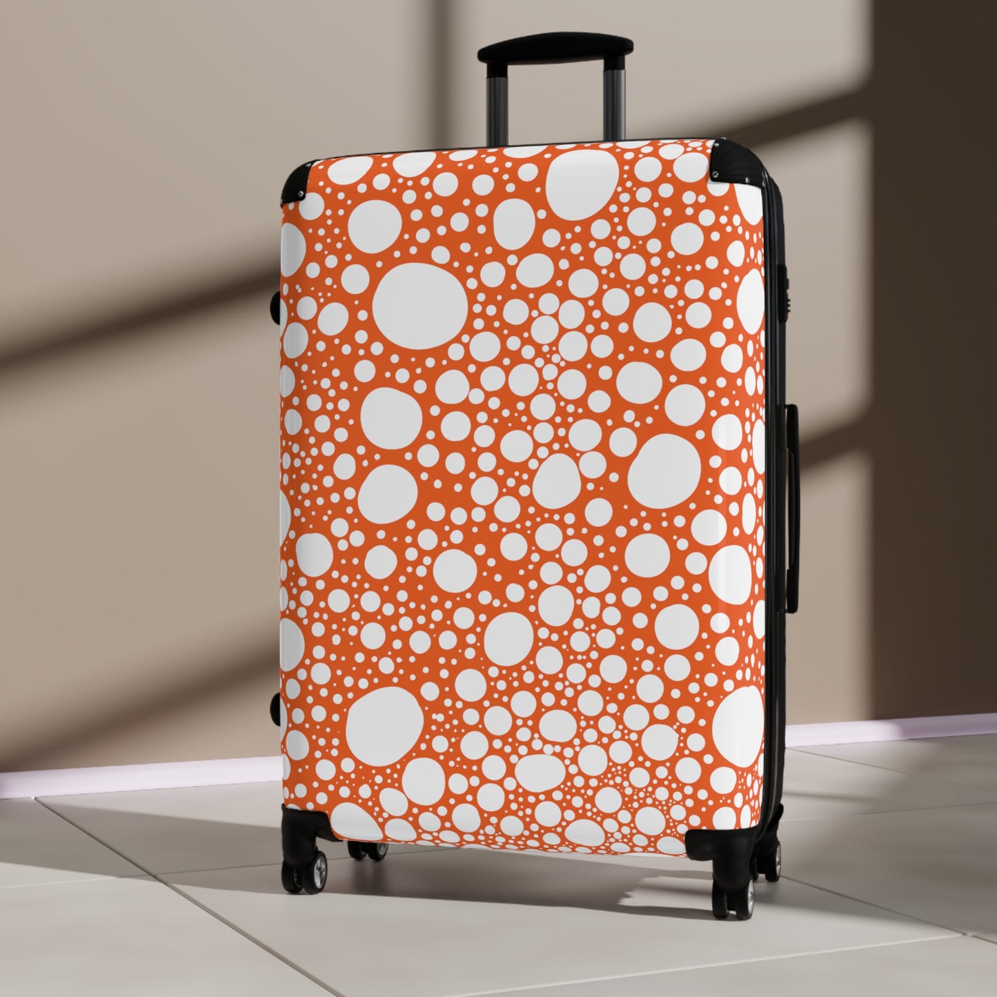 Blanca Ink Spots on Orange Suitcase