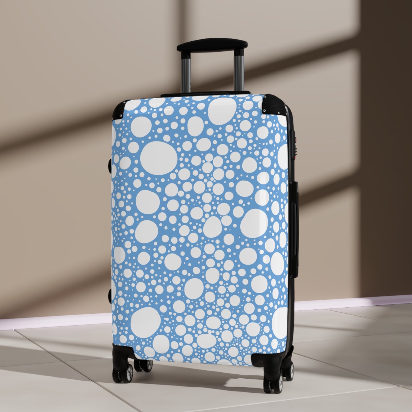 Blanca Ink Spots on Light Blue Suitcase